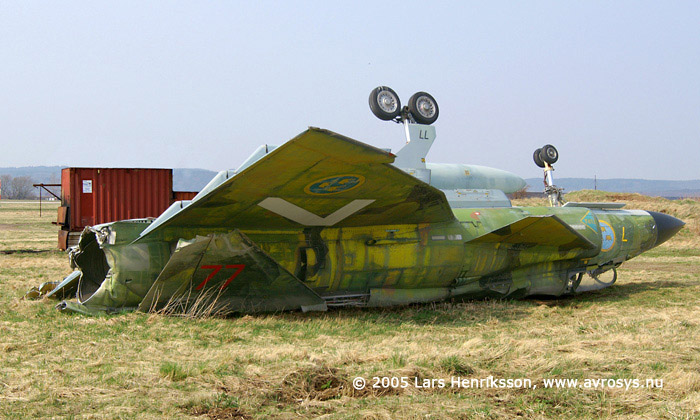 Swedish Attack Aircraft AJ 37 Viggen. Air Force number 37077. Marking from its active time at Wing F7, Stens. Here at the fire and rescue training site at Halmstad. 