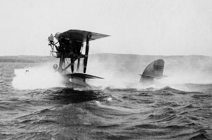 Swedish Army Aviation Hydroplane Macchi M 7 takes off from  Lake Roxen. Pilot is the well-known Magnus Bng.